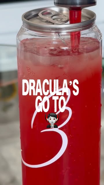 Dracula’s GO TO from Baglory’s Instagram: a red cherry drink in a sealed can glass with a red straw.